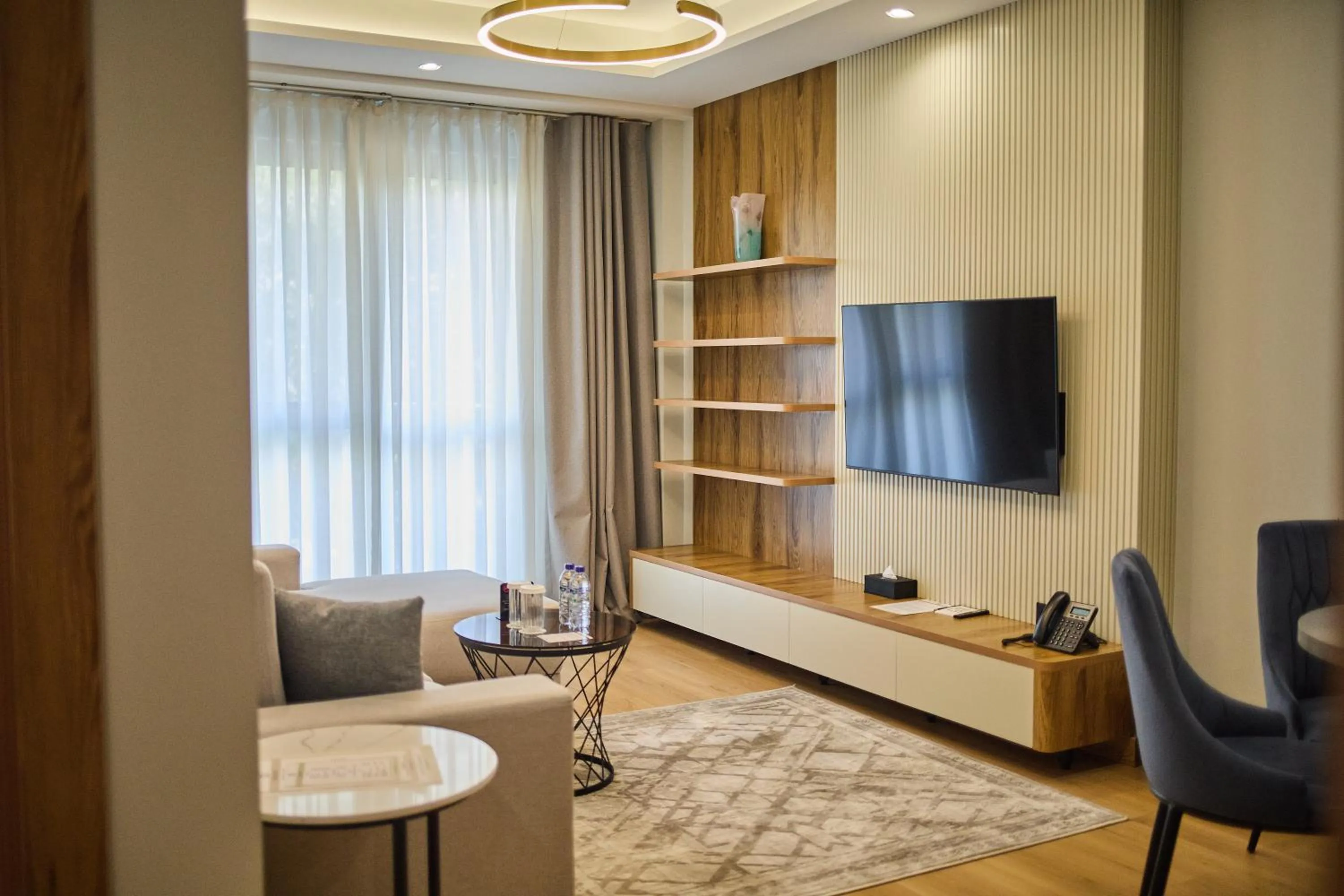 Communal lounge/ TV room in STYLO Residences & Suites