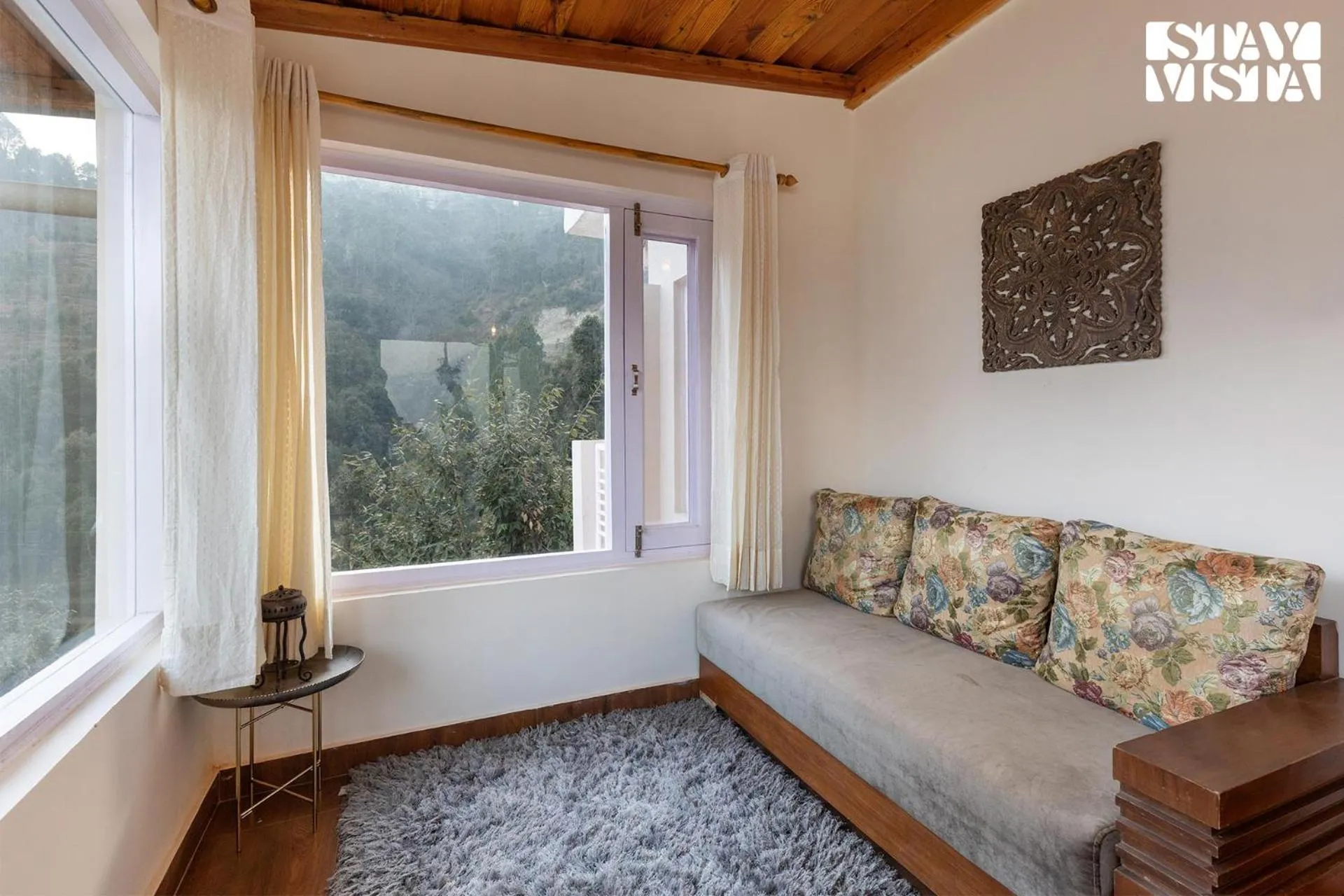 Living room in StayVista at Bird's Crest Valley Villa