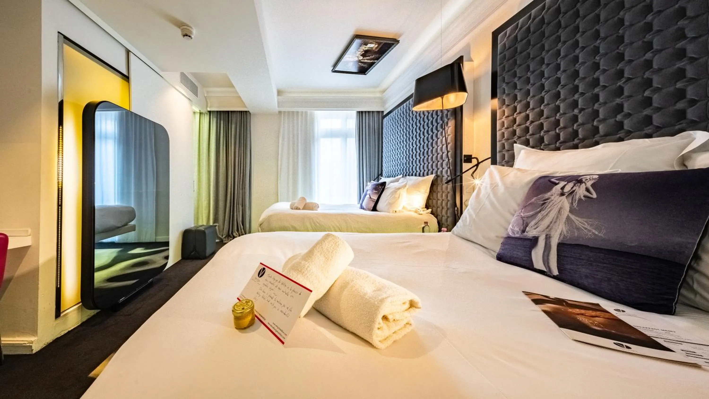 Bed in Vertigo Hotel, By Marriott, a Member of Design Hotels