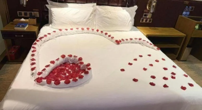 Bed in James Joyce Coffetel Shijiazhuang Wanda Plaza Tangu Metro Station