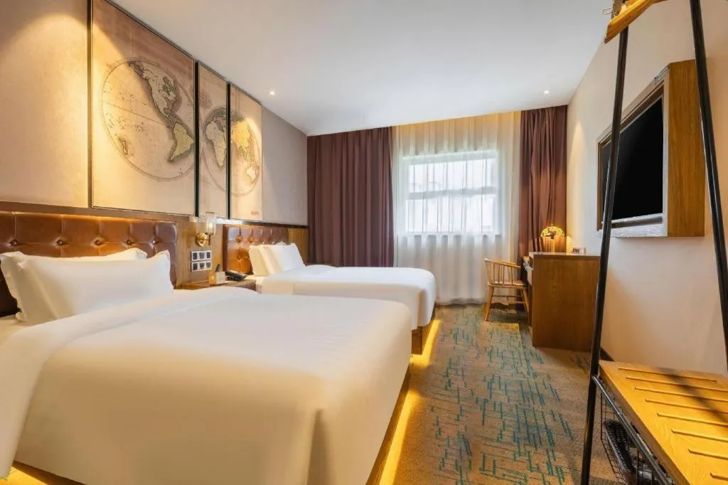 Bed in James Joyce Coffetel Tianjin Railway Station