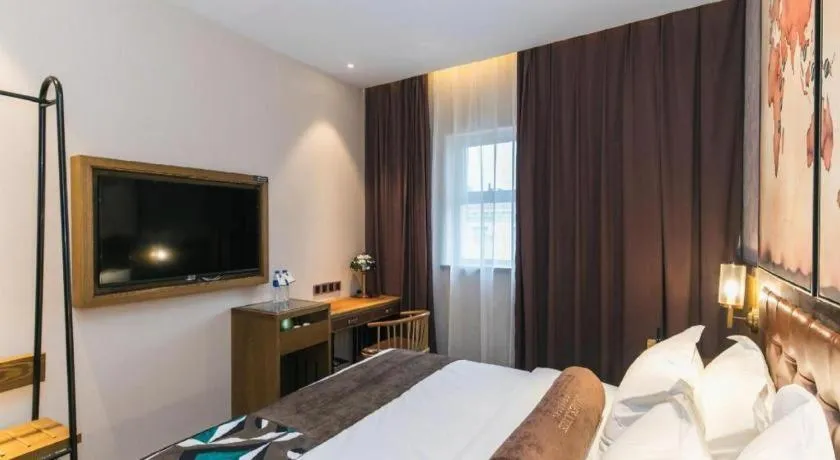 Bed in James Joyce Coffetel Tianjin Railway Station