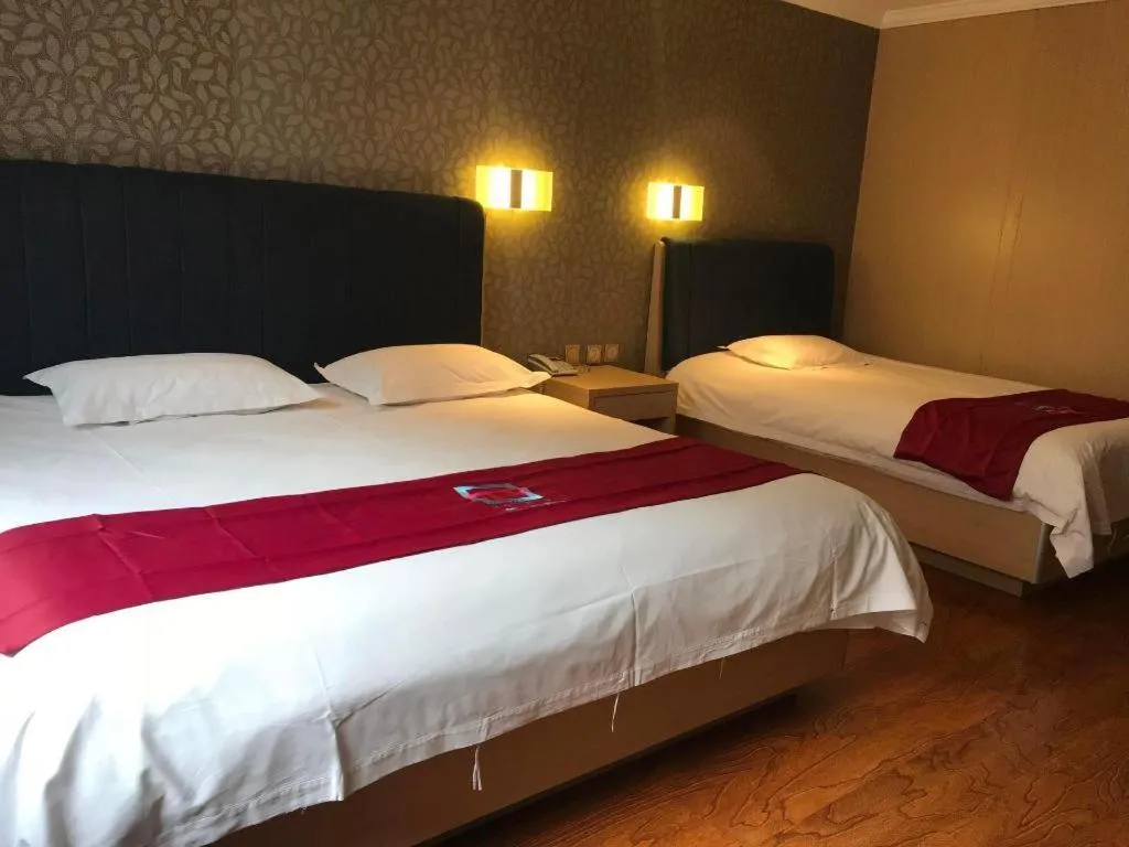 Bed in PAI Hotels Jinzhou Yi County Railway Station