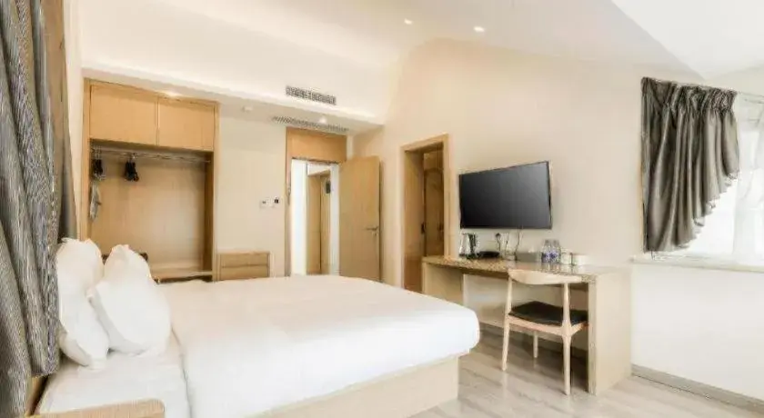 Bed in ZMAX Hotels Wuhan East Lake Bed in ZMAX Hotels Wuhan East Lake