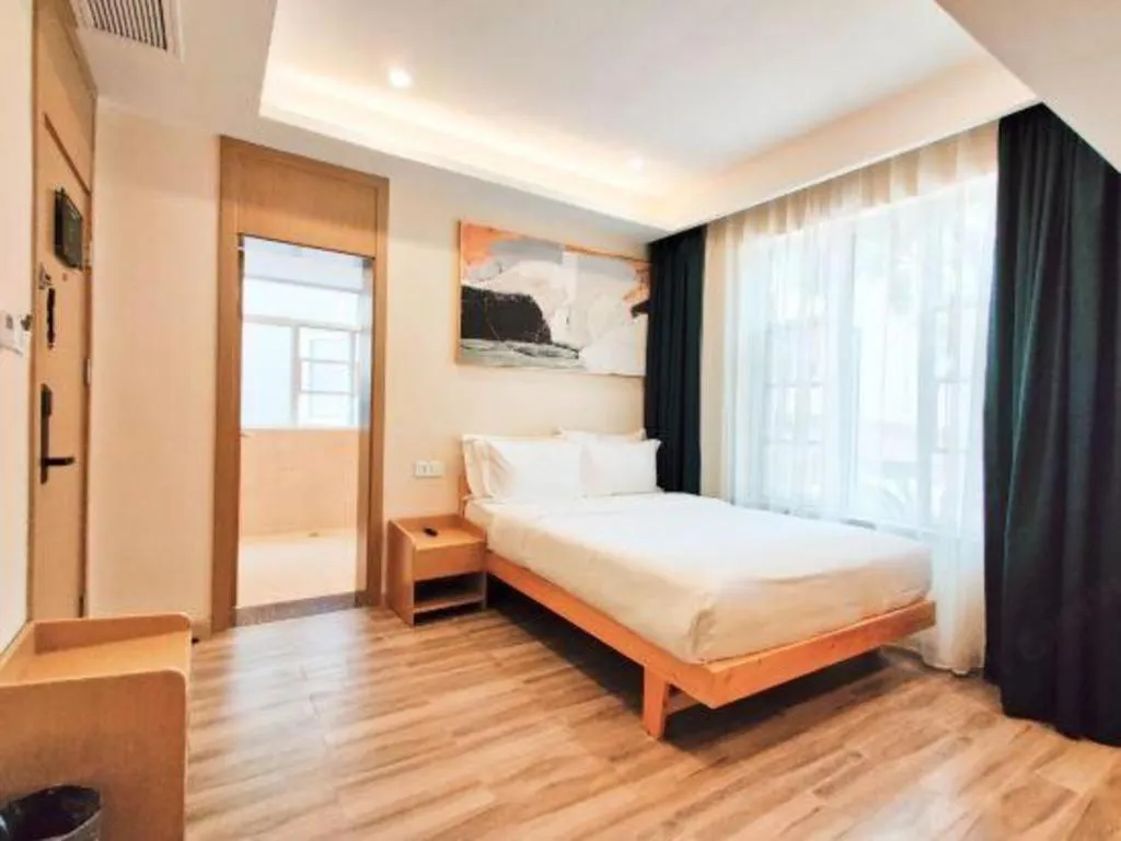 Bed in ZMAX Hotels Wuhan East Lake