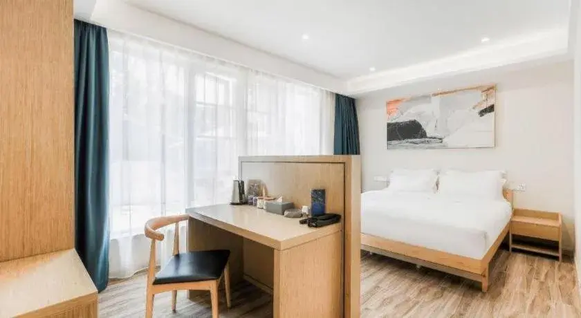 Bed in ZMAX Hotels Wuhan East Lake Bed in ZMAX Hotels Wuhan East Lake