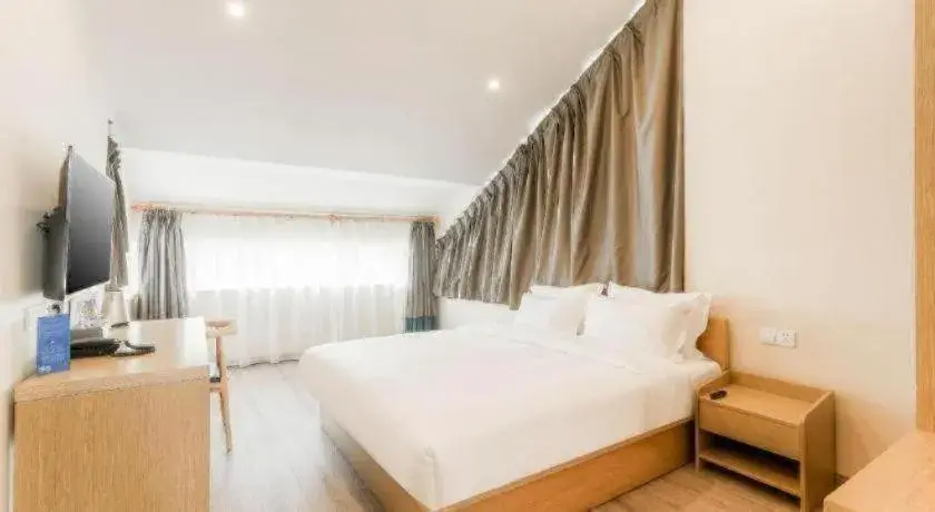 Bed in ZMAX Hotels Wuhan East Lake Bed in ZMAX Hotels Wuhan East Lake