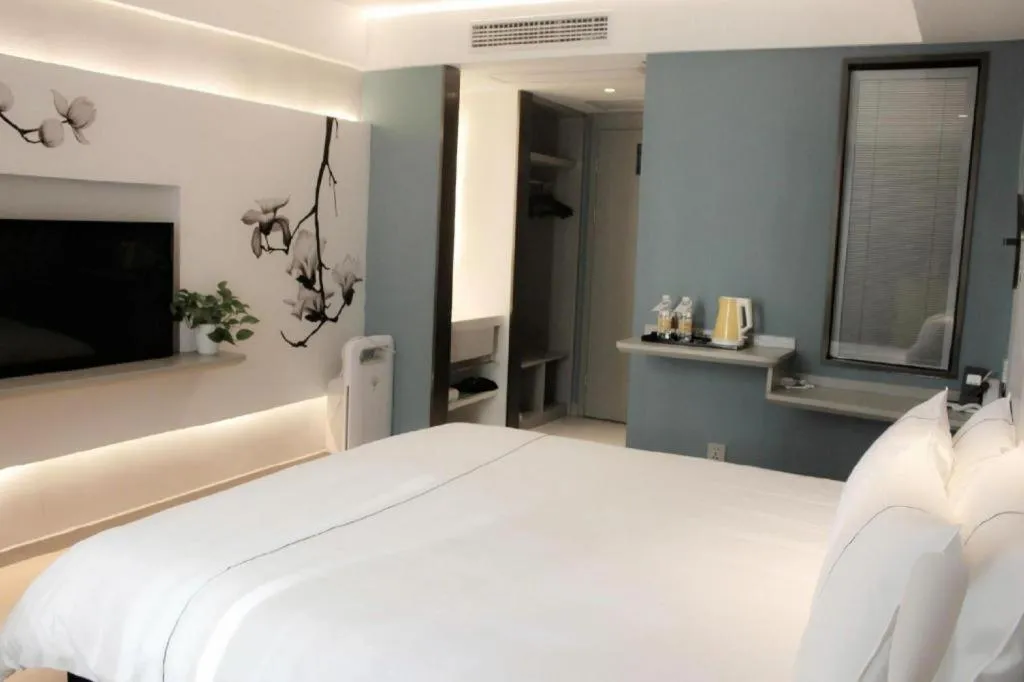 Bed in Magnotel Hotel Wuhan Jiangtan Lihuangpo Road Pedestrian Street