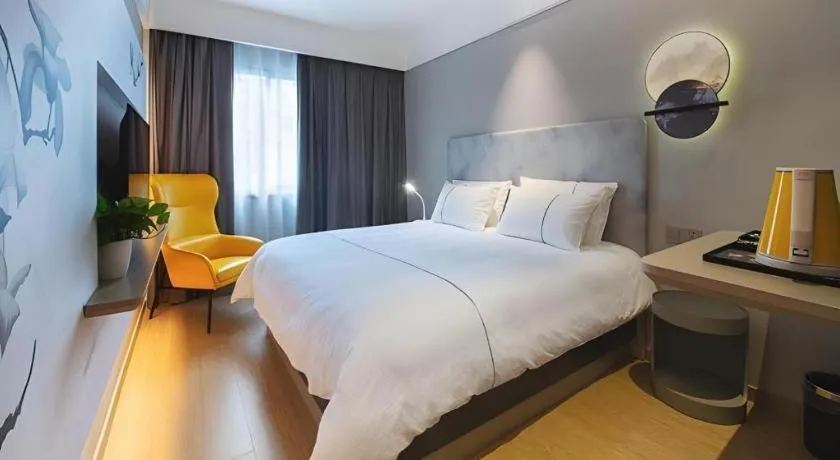 Bed in Magnotel Hotel Wuhan Jiangtan Lihuangpo Road Pedestrian Street