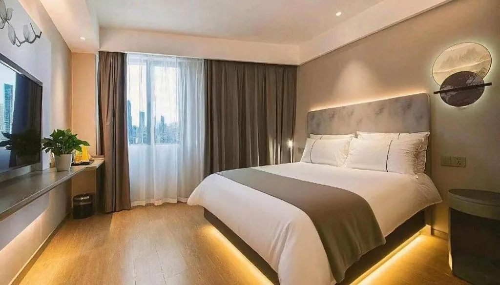 Bed in Magnotel Hotel Wuhan Jiangtan Lihuangpo Road Pedestrian Street