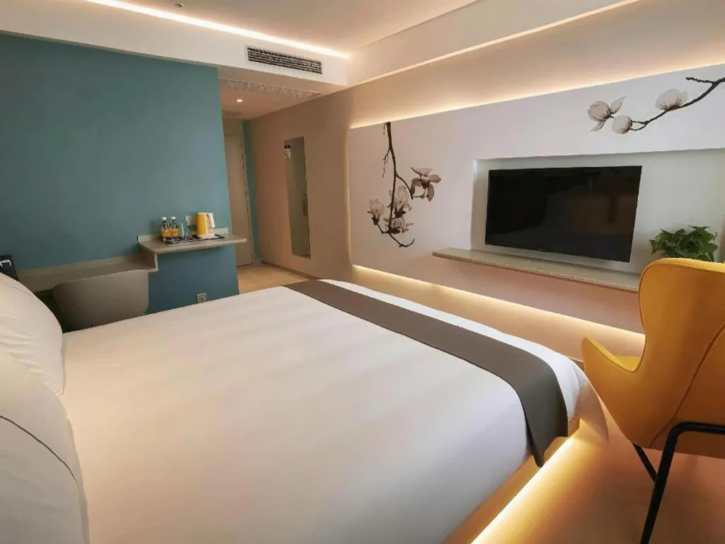 Bed in Magnotel Hotel Wuhan Jiangtan Lihuangpo Road Pedestrian Street