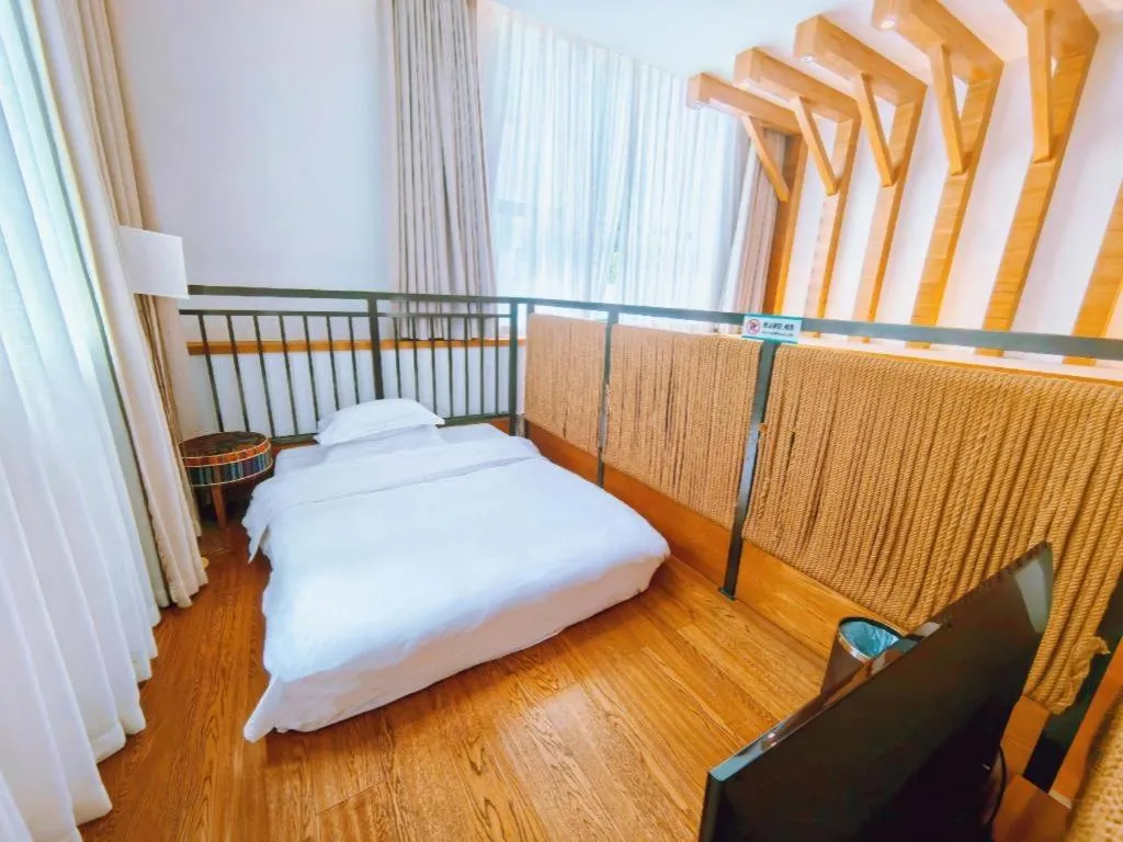 Bed in Ramada by Wyndham Guergou