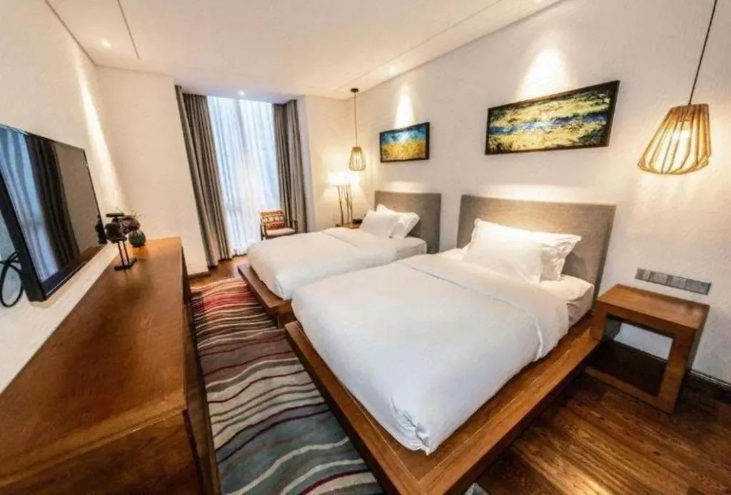 Bed in Ramada by Wyndham Guergou