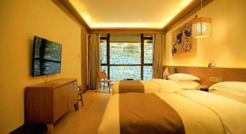 Bed in Ramada by Wyndham Guergou