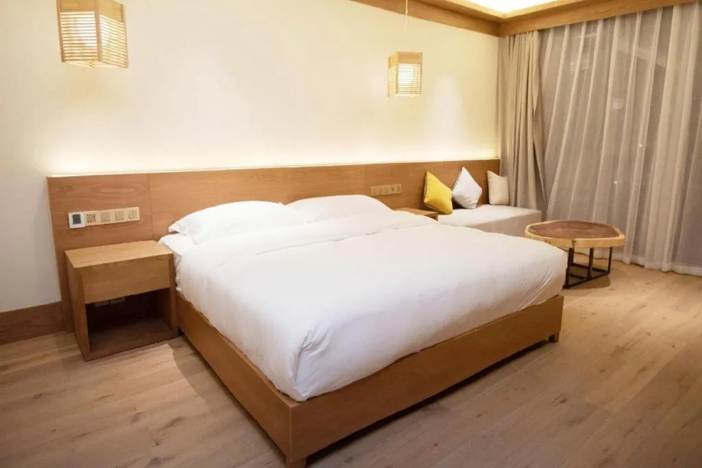 Bed in Ramada by Wyndham Guergou