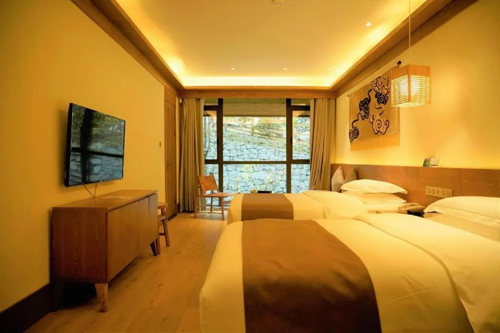 Bed in Ramada by Wyndham Guergou