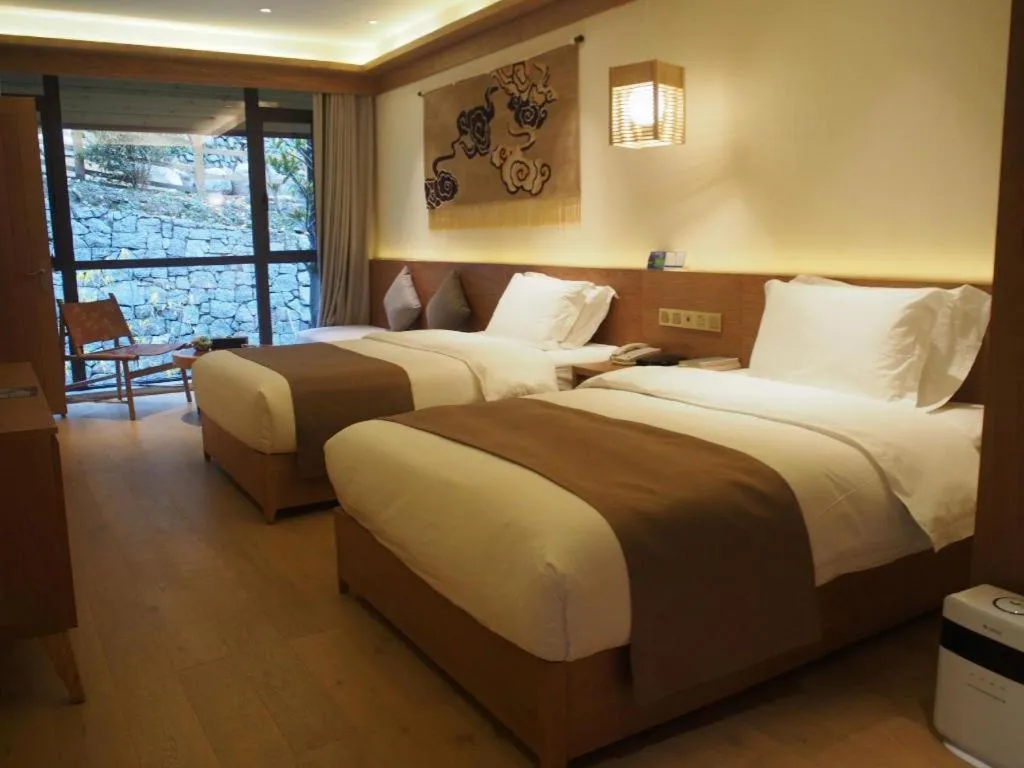 Bed in Ramada by Wyndham Guergou