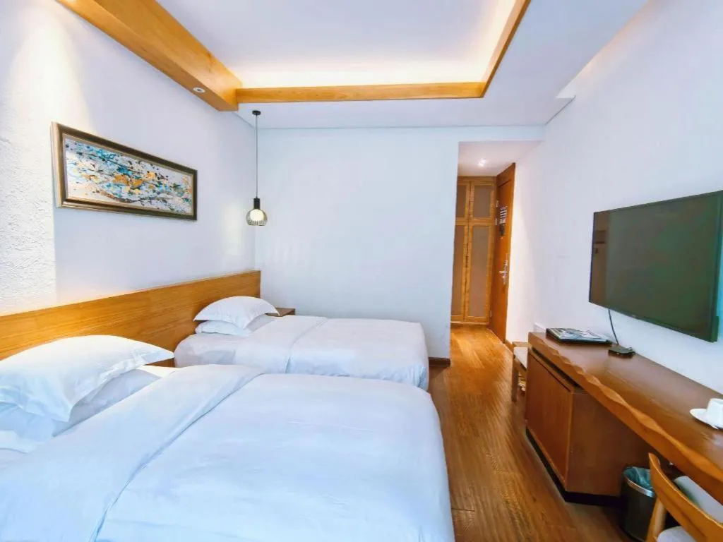 Bed in Ramada by Wyndham Guergou