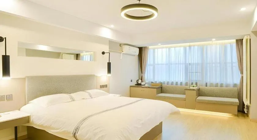 Bed in Urban Garden Hotel Chengyang District Government Liuting Airport