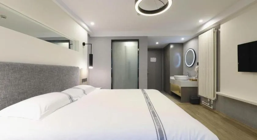 Bed in Urban Garden Hotel Chengyang District Government Liuting Airport