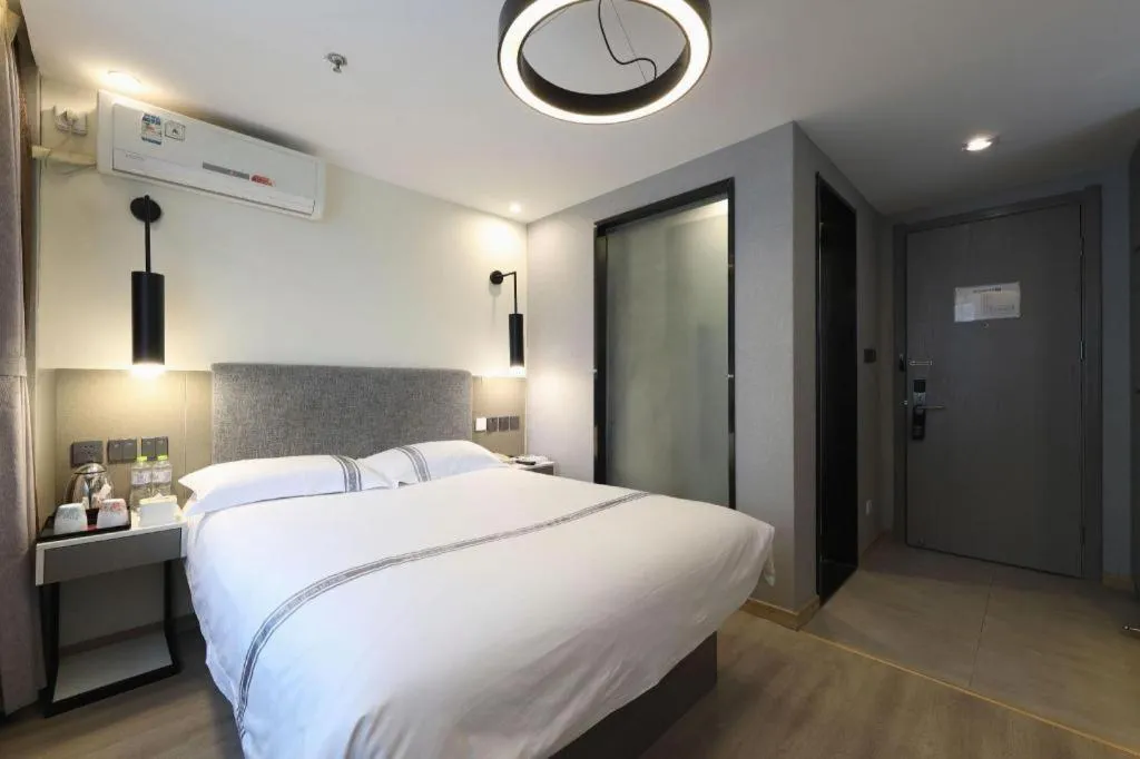 Bed in Urban Garden Hotel Chengyang District Government Liuting Airport