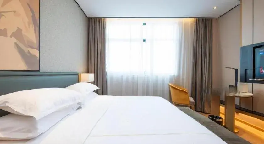 Bed in The Hotel V Nanjing Lishui Bed in The Hotel V Nanjing Lishui