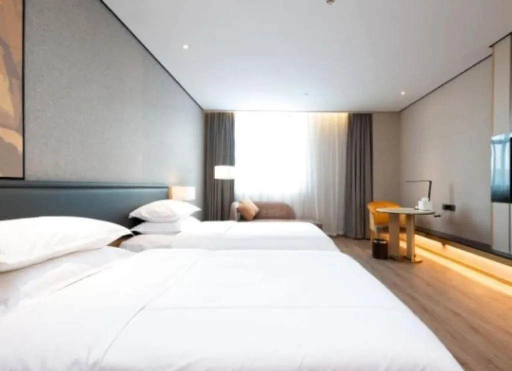 Bed in The Hotel V Nanjing Lishui