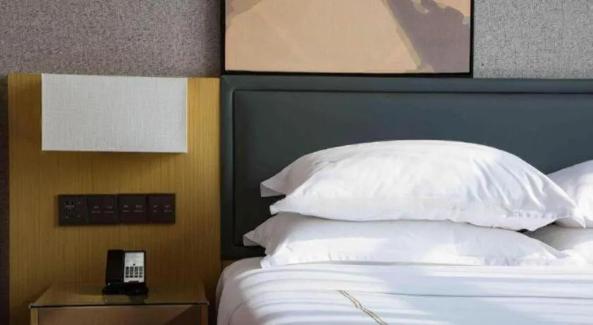 Bed in The Hotel V Nanjing Lishui