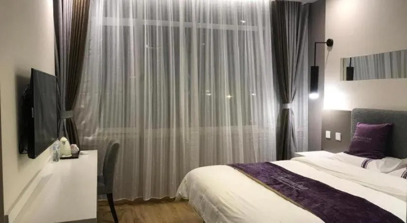 Bed in City 118 Hotel Qingdao Boardcast Tower