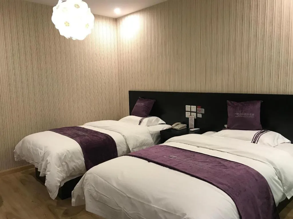Bed in City 118 Hotel Qingdao Boardcast Tower