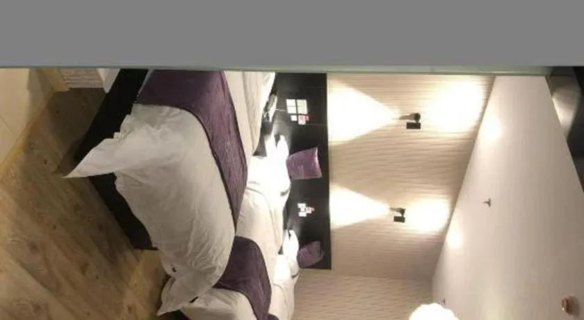 Bed in City 118 Hotel Qingdao Boardcast Tower