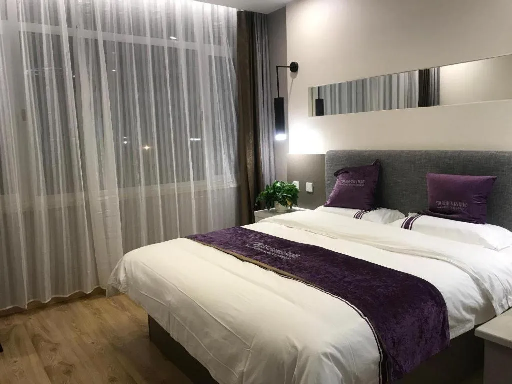 Bed in City 118 Hotel Qingdao Boardcast Tower
