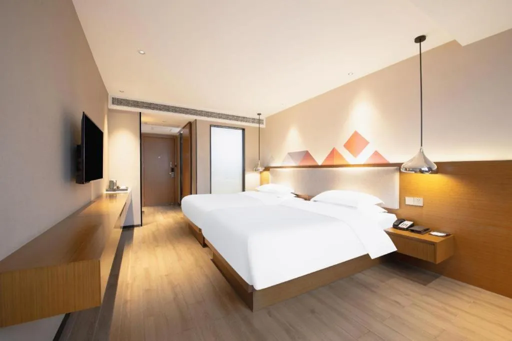 Bed in Borrman Hotel Zhanjiang Wuchuan Jinsha Plaza