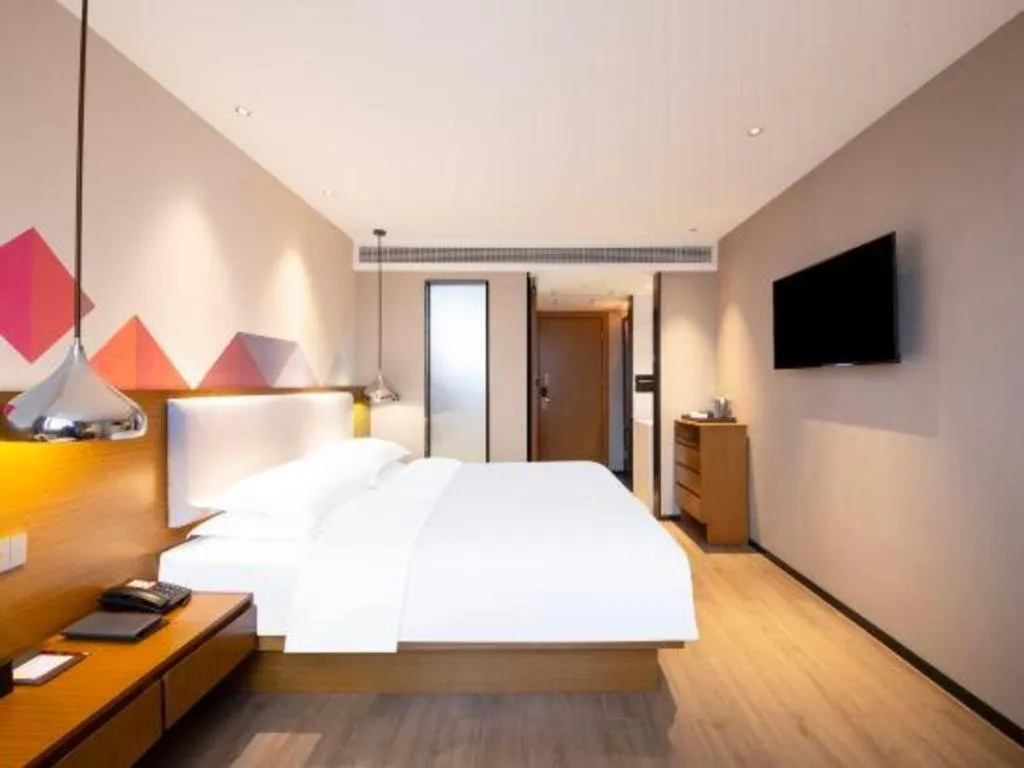 Bed in Borrman Hotel Zhanjiang Wuchuan Jinsha Plaza