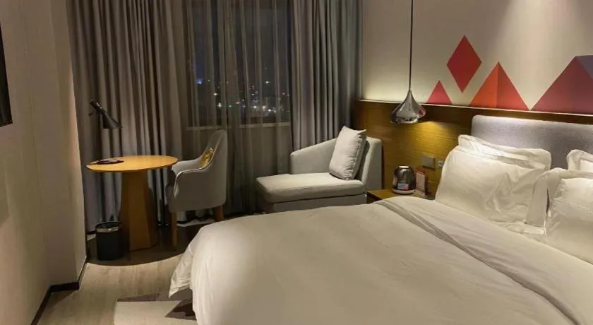 Bed in Borrman Hotel Zhanjiang Wuchuan Jinsha Plaza