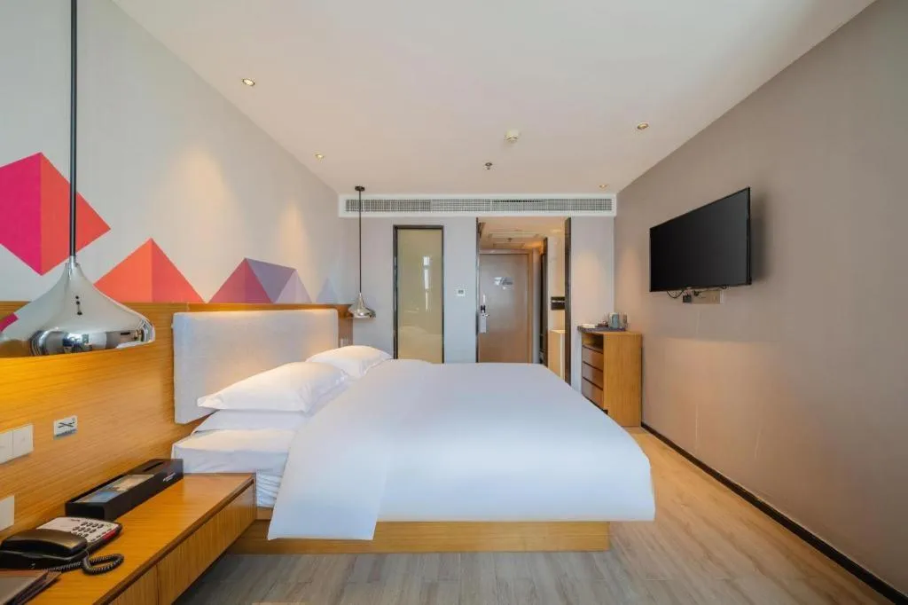 Bed in Borrman Hotel Zhanjiang Wuchuan Jinsha Plaza