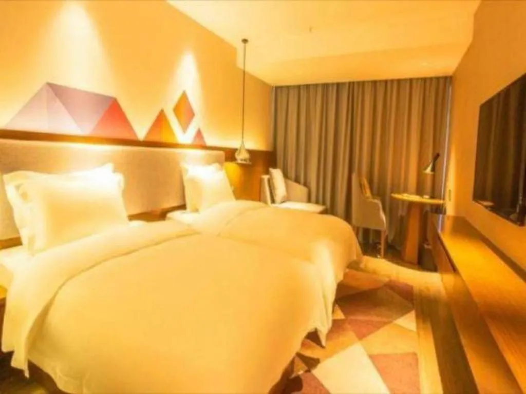 Bed in Borrman Hotel Zhanjiang Wuchuan Jinsha Plaza