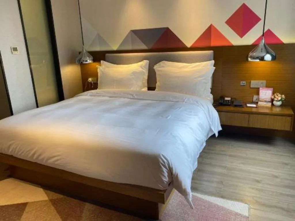 Bed in Borrman Hotel Zhanjiang Wuchuan Jinsha Plaza
