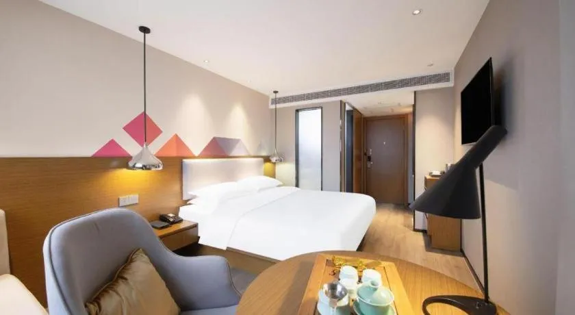 Bed in Borrman Hotel Zhanjiang Wuchuan Jinsha Plaza