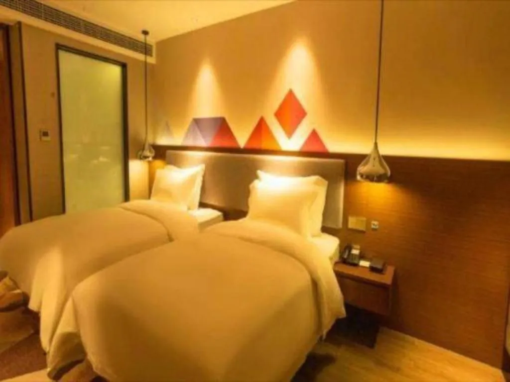 Bed in Borrman Hotel Zhanjiang Wuchuan Jinsha Plaza