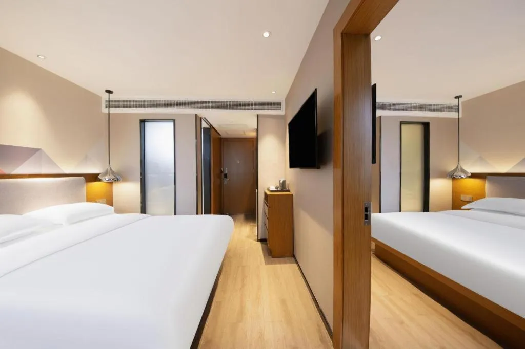 Bed in Borrman Hotel Zhanjiang Wuchuan Jinsha Plaza