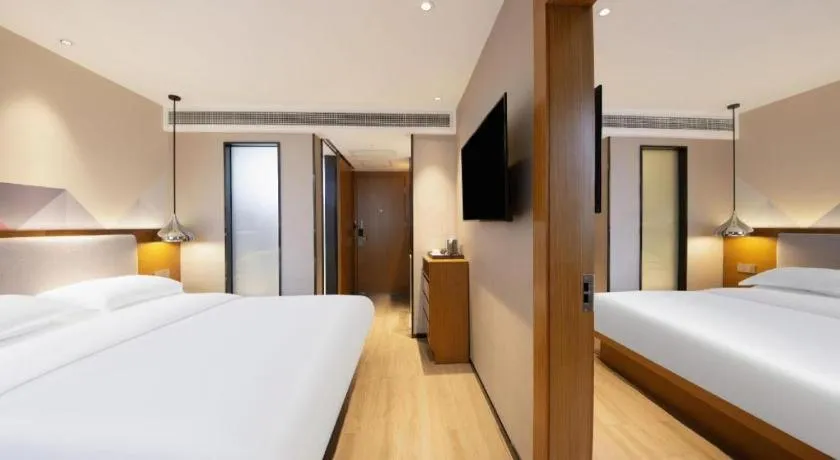 Bed in Borrman Hotel Zhanjiang Wuchuan Jinsha Plaza