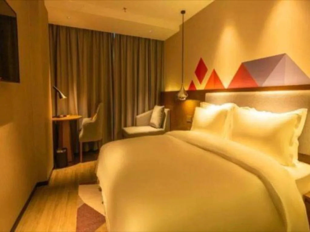 Bed in Borrman Hotel Zhanjiang Wuchuan Jinsha Plaza