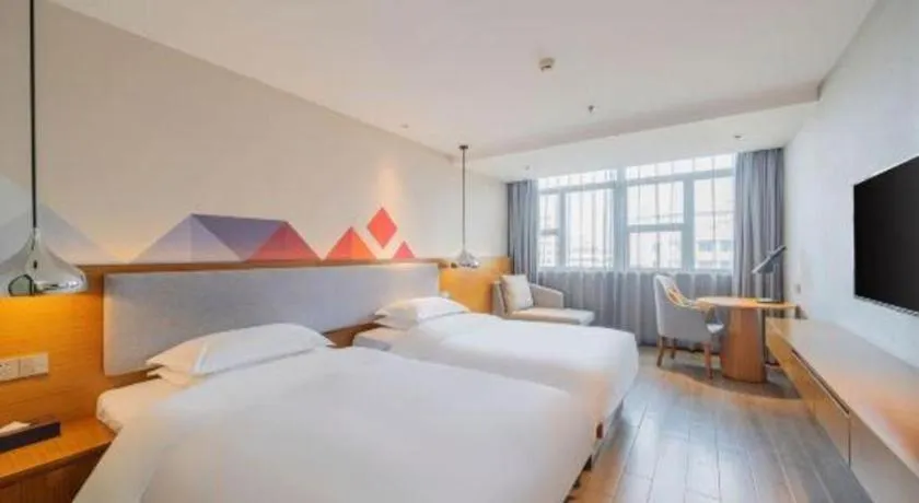 Bed in Borrman Hotel Zhanjiang Wuchuan Jinsha Plaza