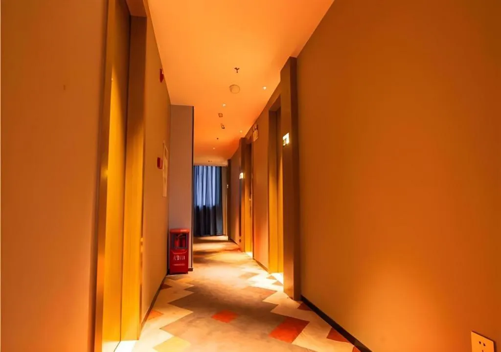 Bed in Borrman Hotel Zhanjiang Wuchuan Jinsha Plaza