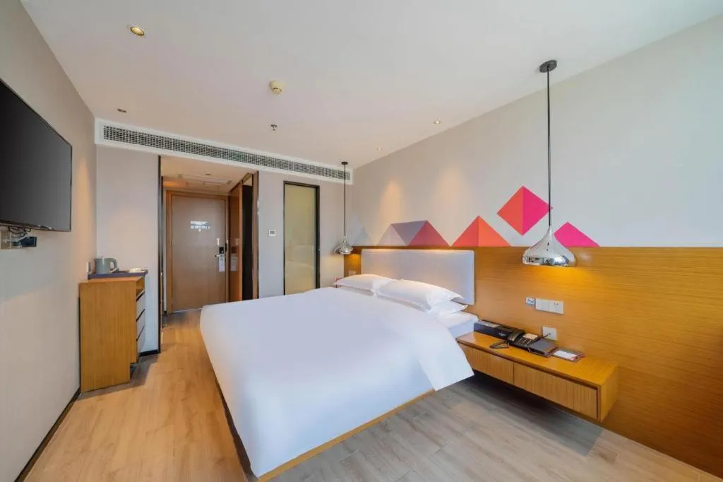 Bed in Borrman Hotel Zhanjiang Wuchuan Jinsha Plaza