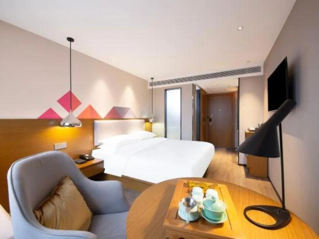 Bed in Borrman Hotel Zhanjiang Wuchuan Jinsha Plaza