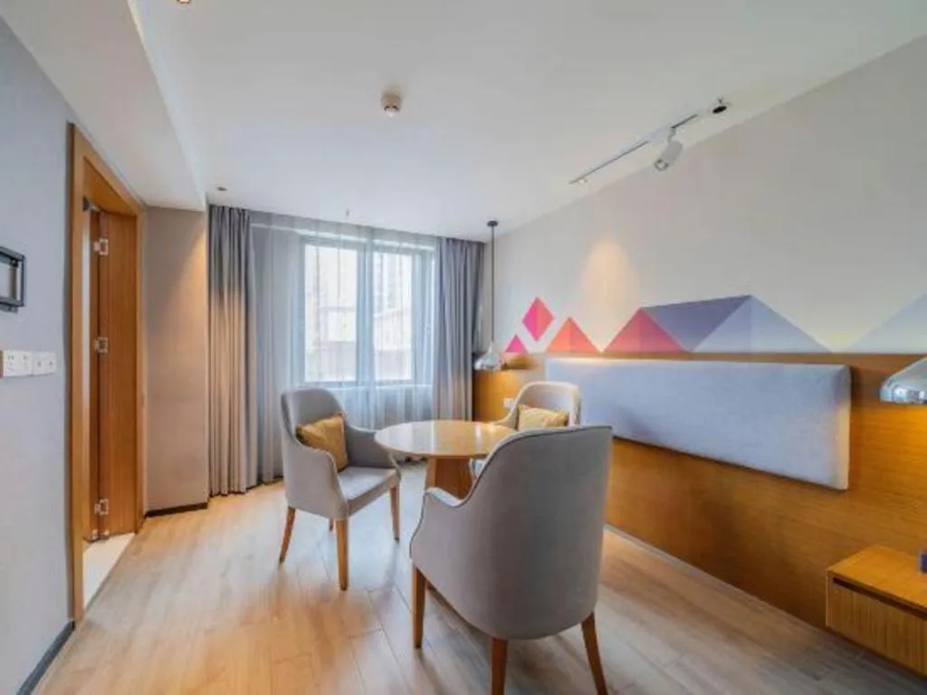 Bed in Borrman Hotel Zhanjiang Wuchuan Jinsha Plaza