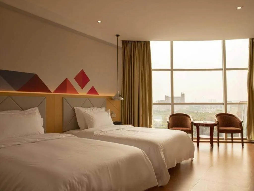 Bed in Borrman Hotel Dongguan Zhongtang