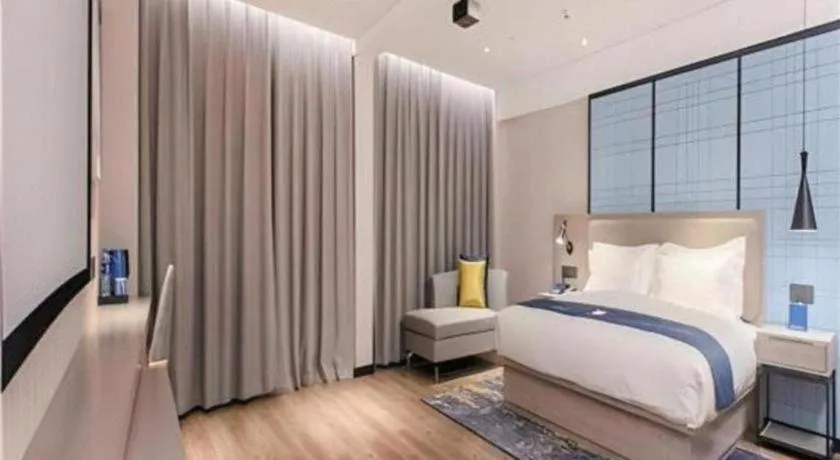 Bed in Echarm Hotel Wuhan Huangpi Xiangyang Avenue